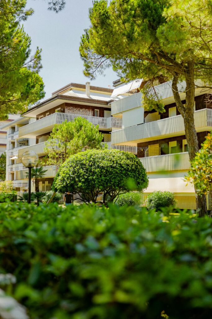 condo with modern building and trees