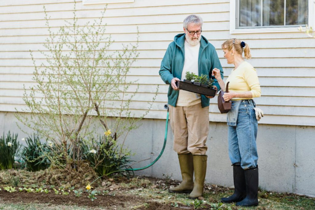Man working on a lady's garden